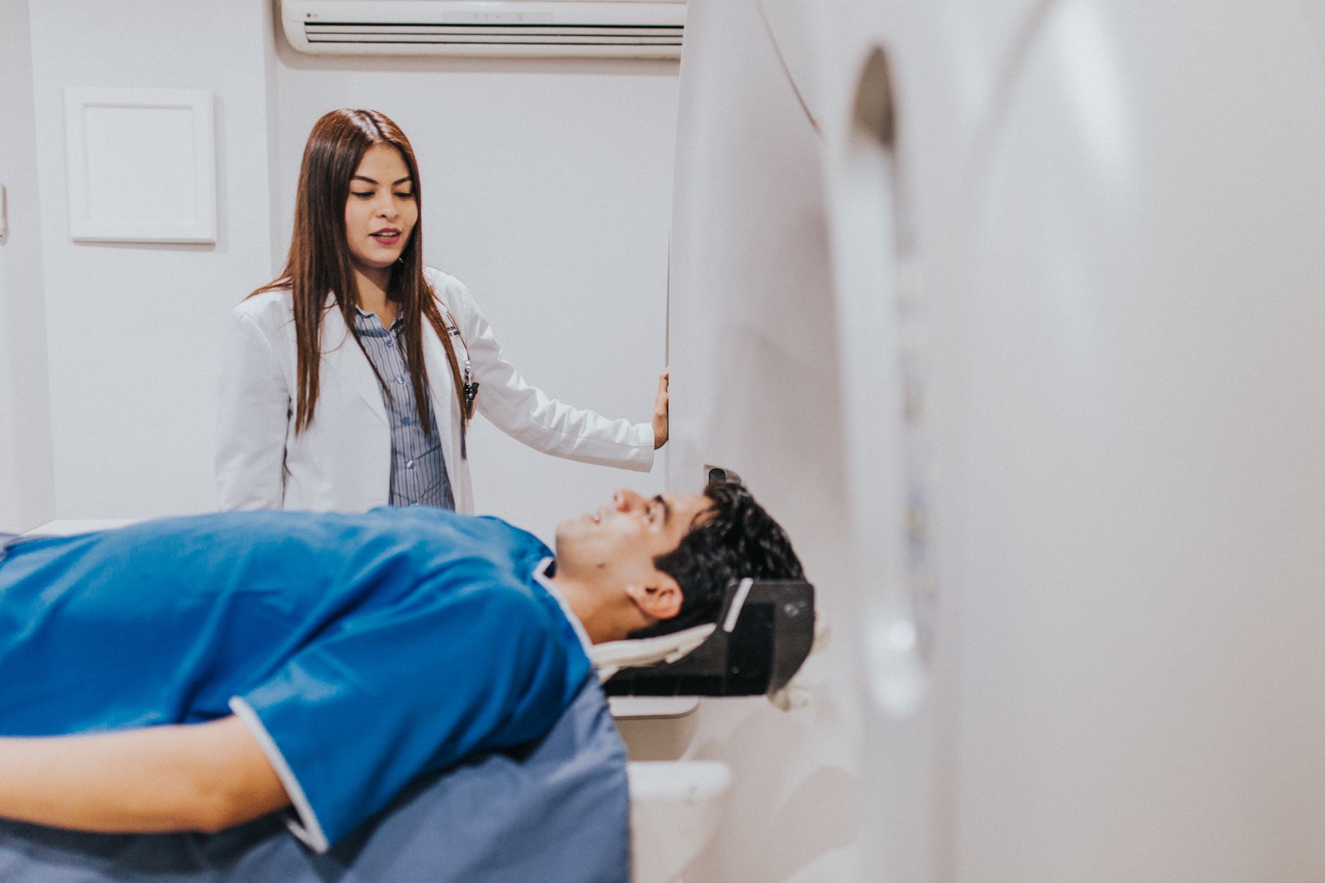 A cardiologist reviewing an echocardiogram scan with a patient
