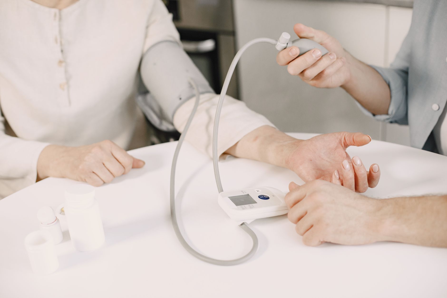 Different types of validated home blood pressure monitors displayed on a table