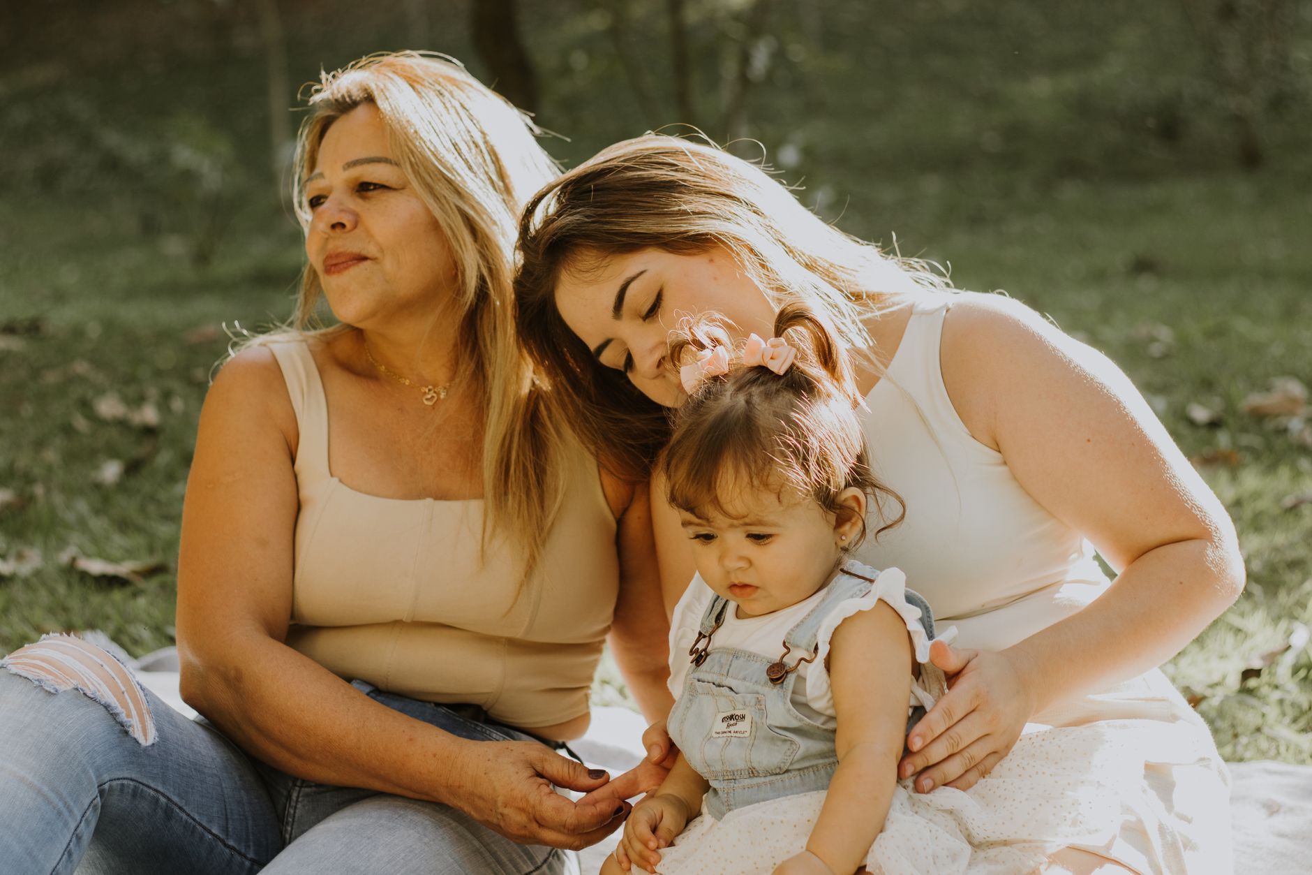 A multi-generational family sitting together, representing the importance of family history in inherited heart conditions