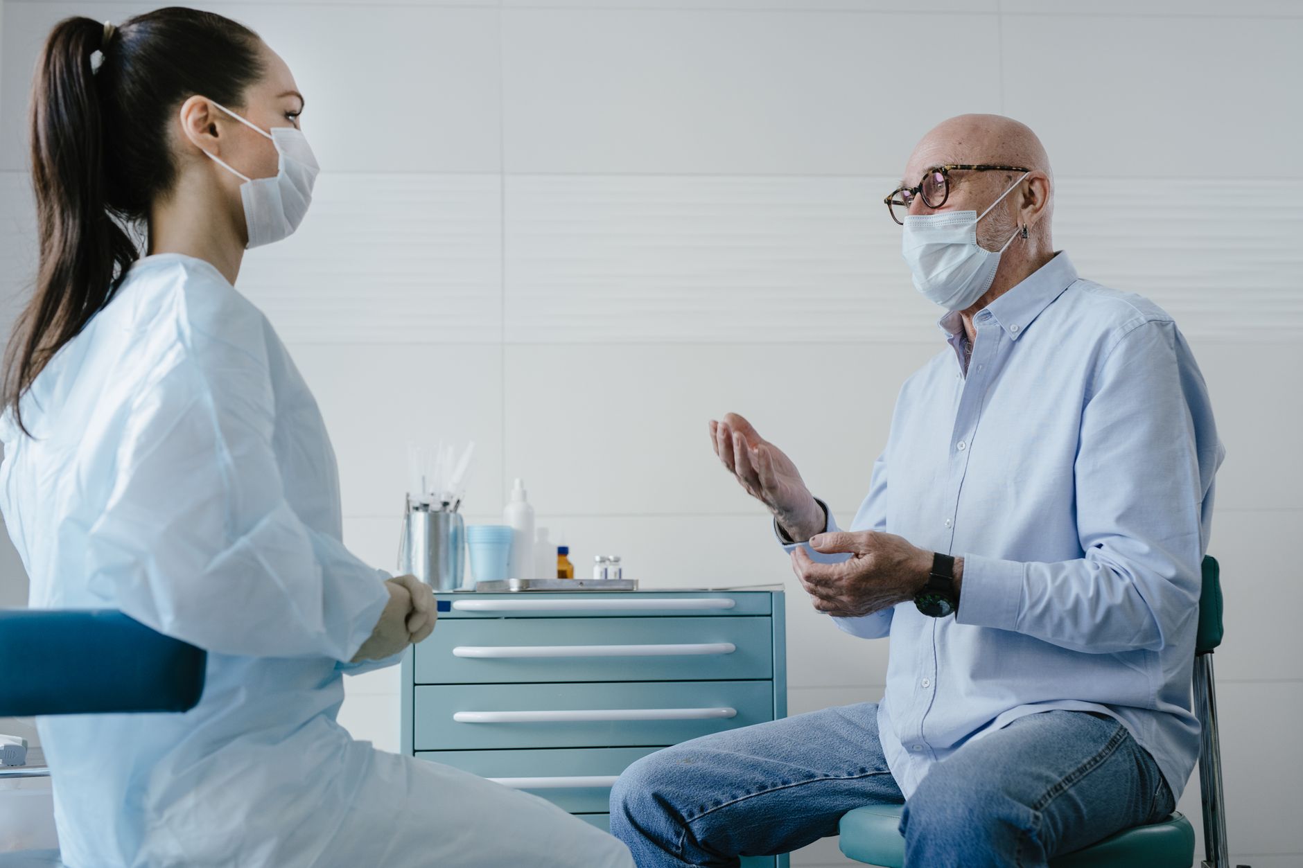 A senior patient having an informed discussion with their cardiologist at a clinic