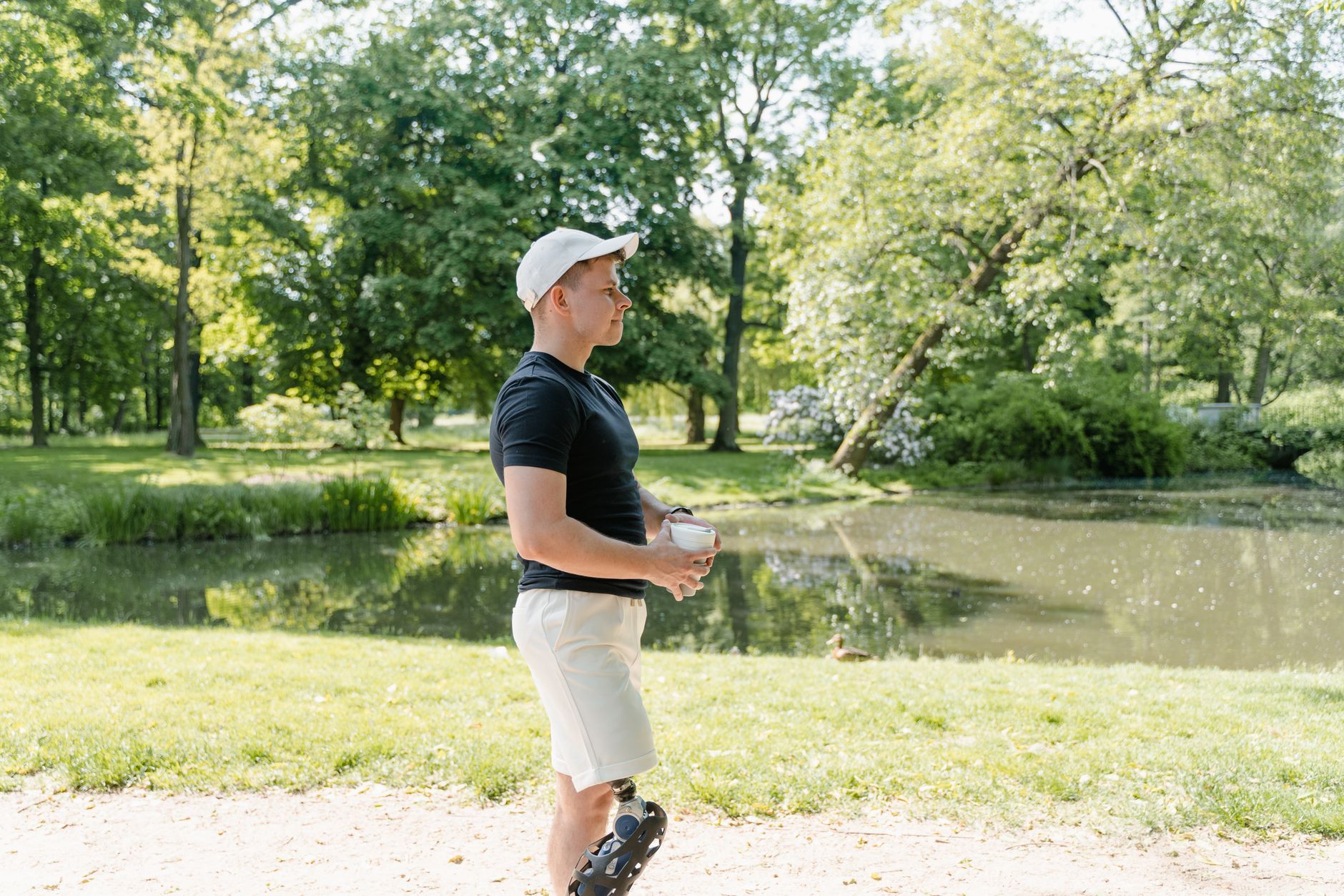 A person walking in a park as part of a healthy heart recovery routine