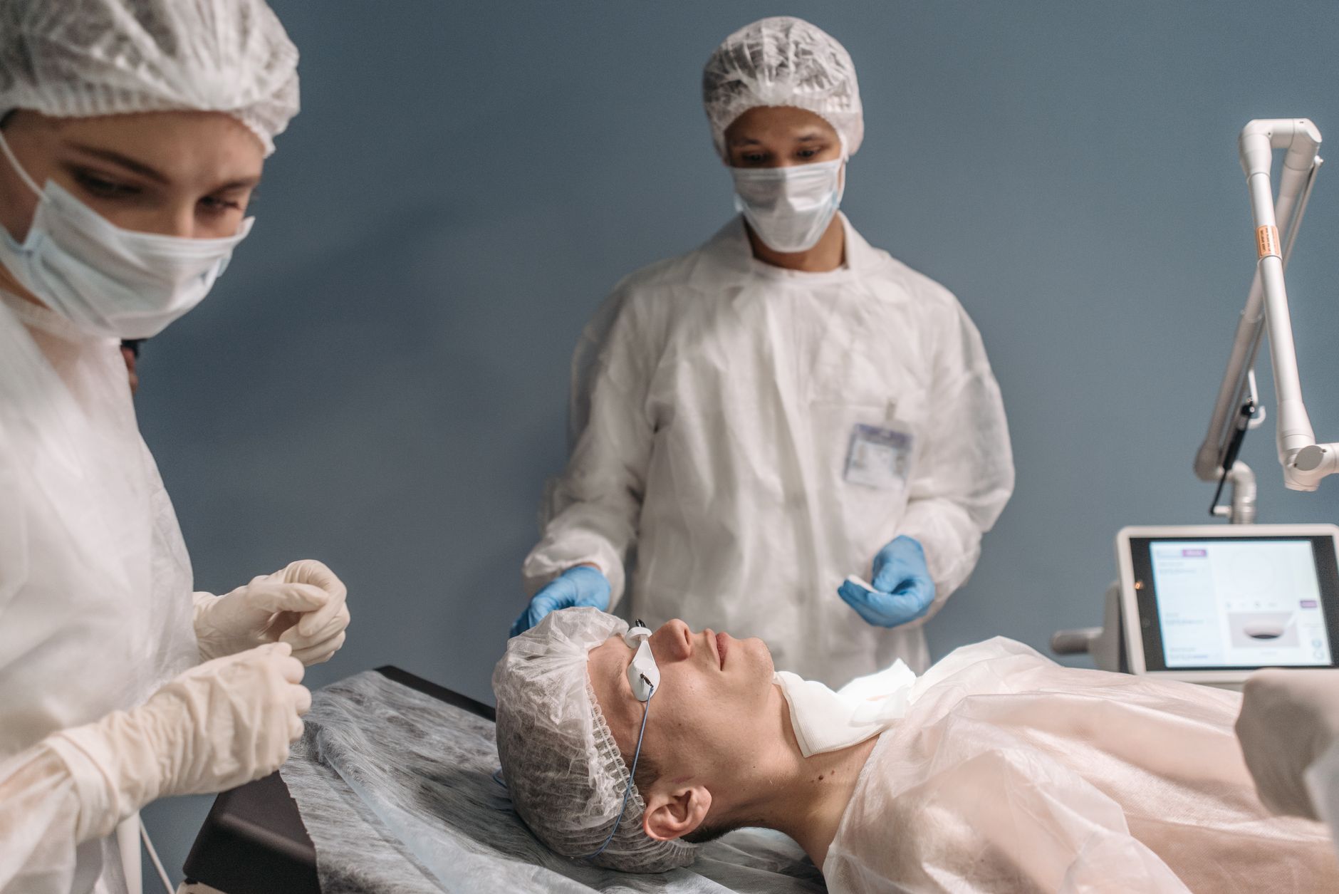 A calm and reassuring medical team preparing a patient for a cardiac procedure