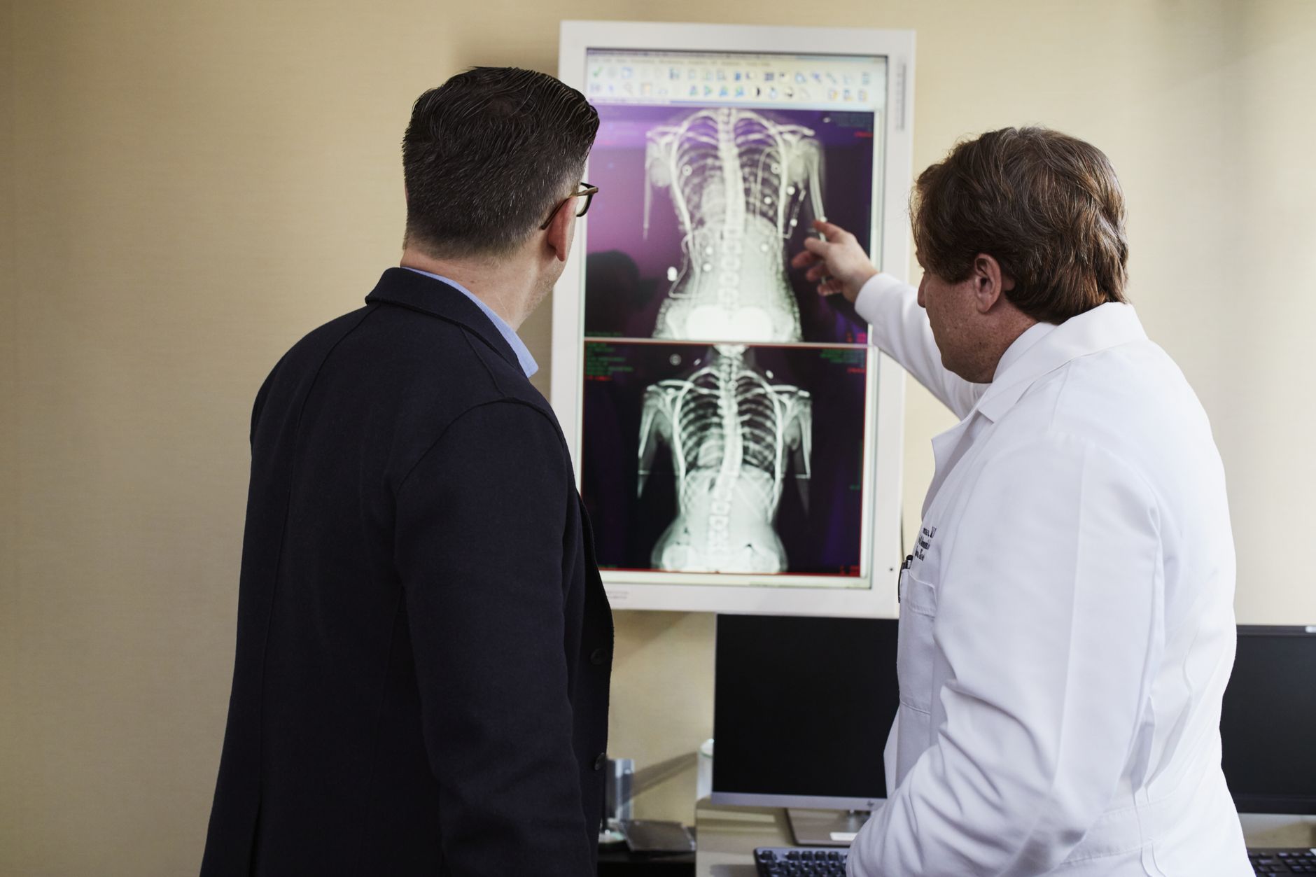 Cardiologist explaining heart anatomy and angina to a patient during a consultation