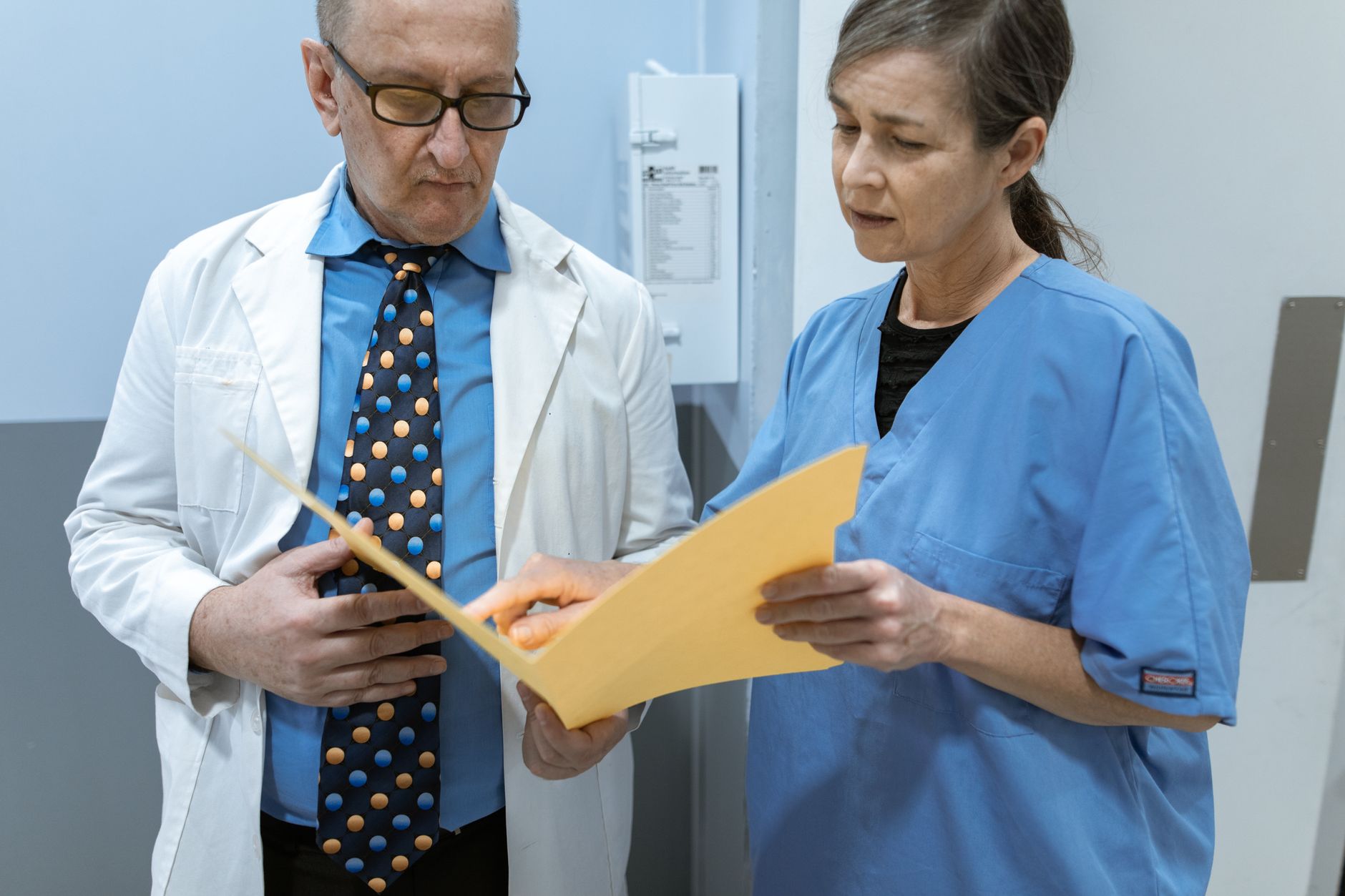 Doctor reviewing a patient's heart medications before a dental procedure