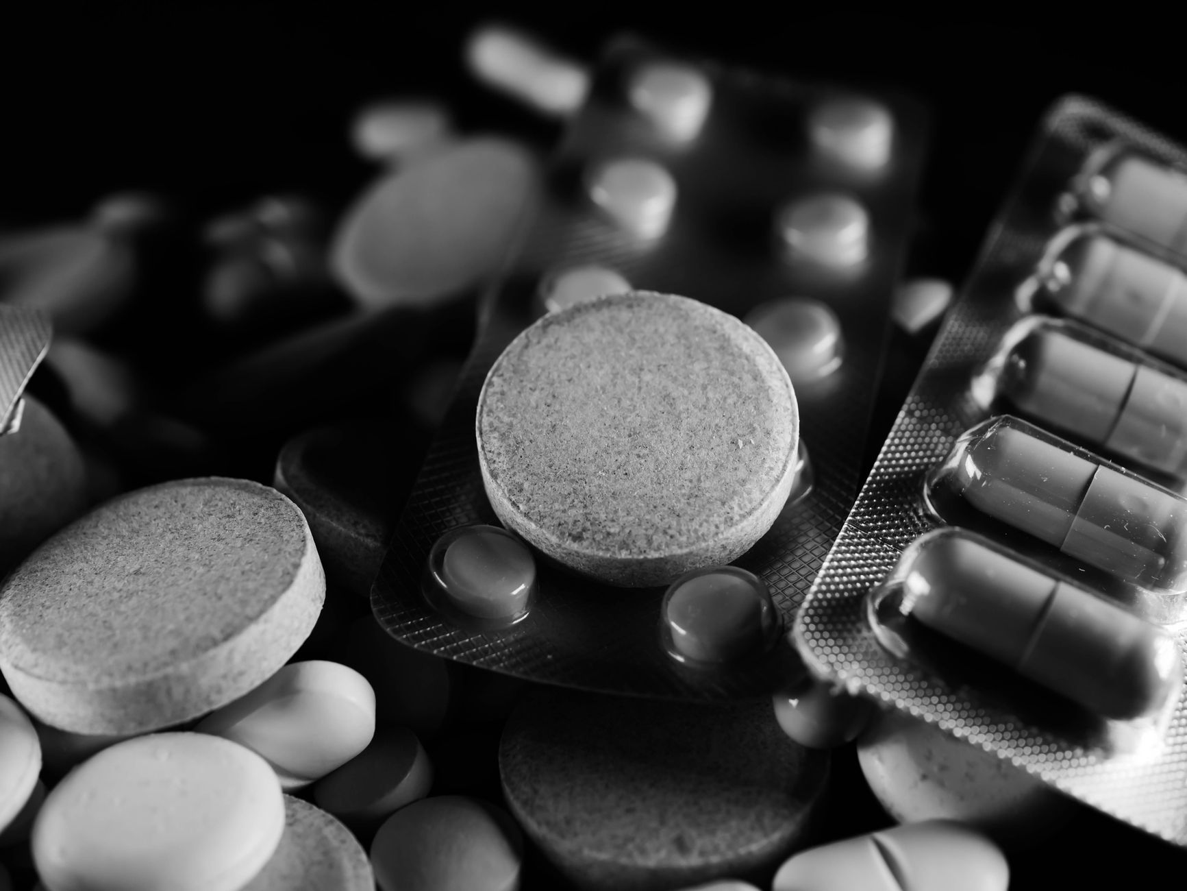 Antibiotic tablets laid out on a surface representing prophylactic medication