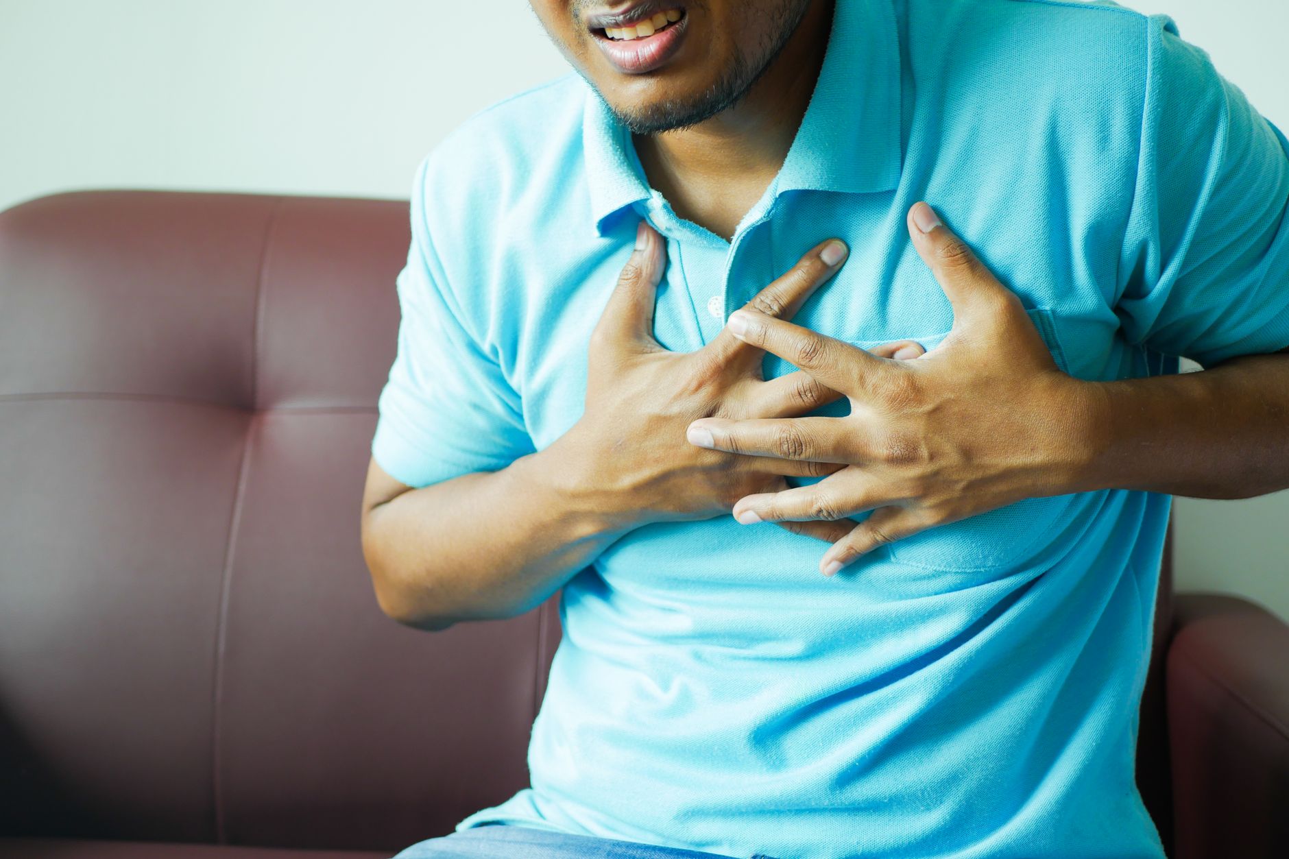 An older person resting and experiencing fatigue, a common symptom of dilated cardiomyopathy