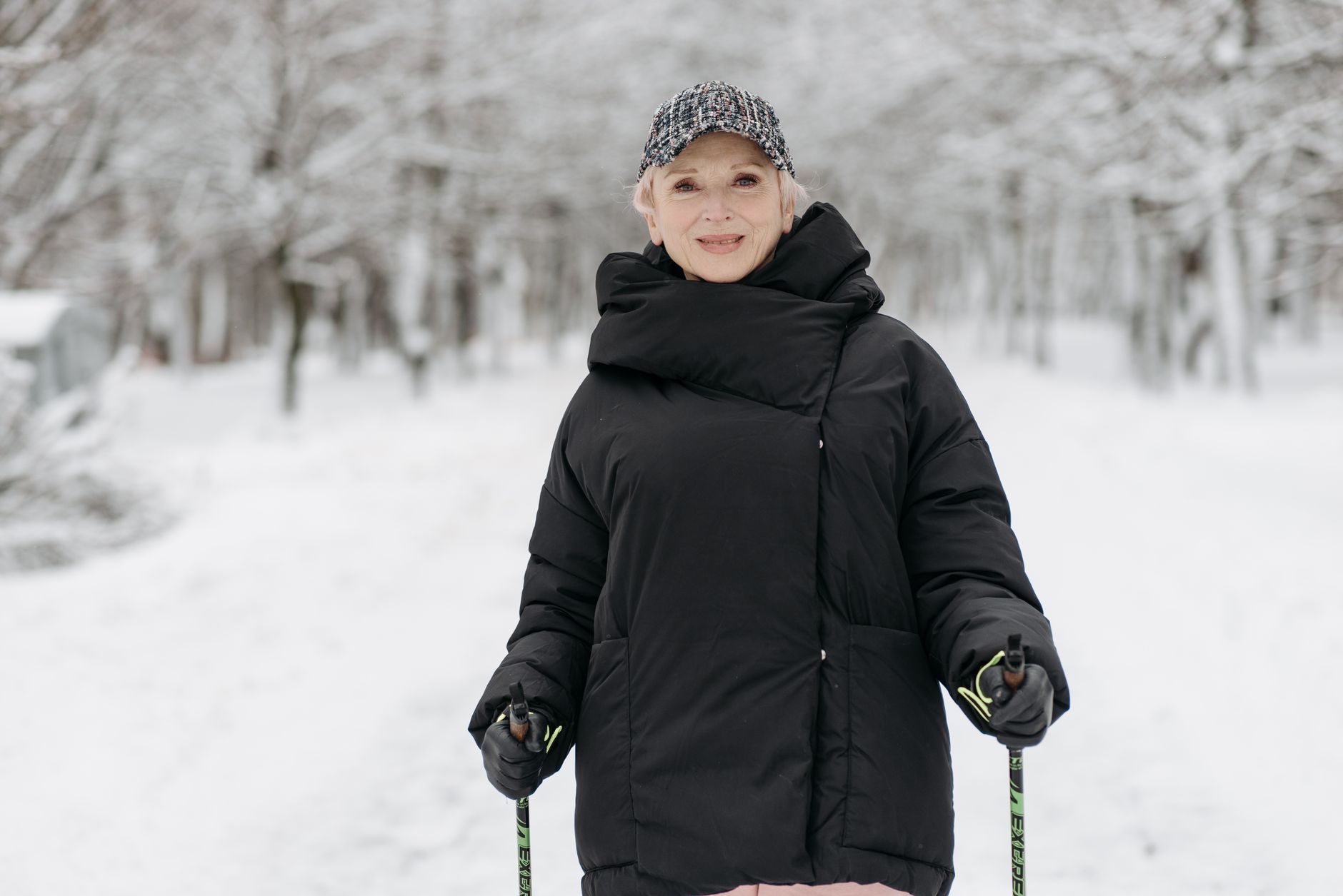 An older adult wearing a warm jacket on a winter morning walk, supporting heart health through gentle exercise