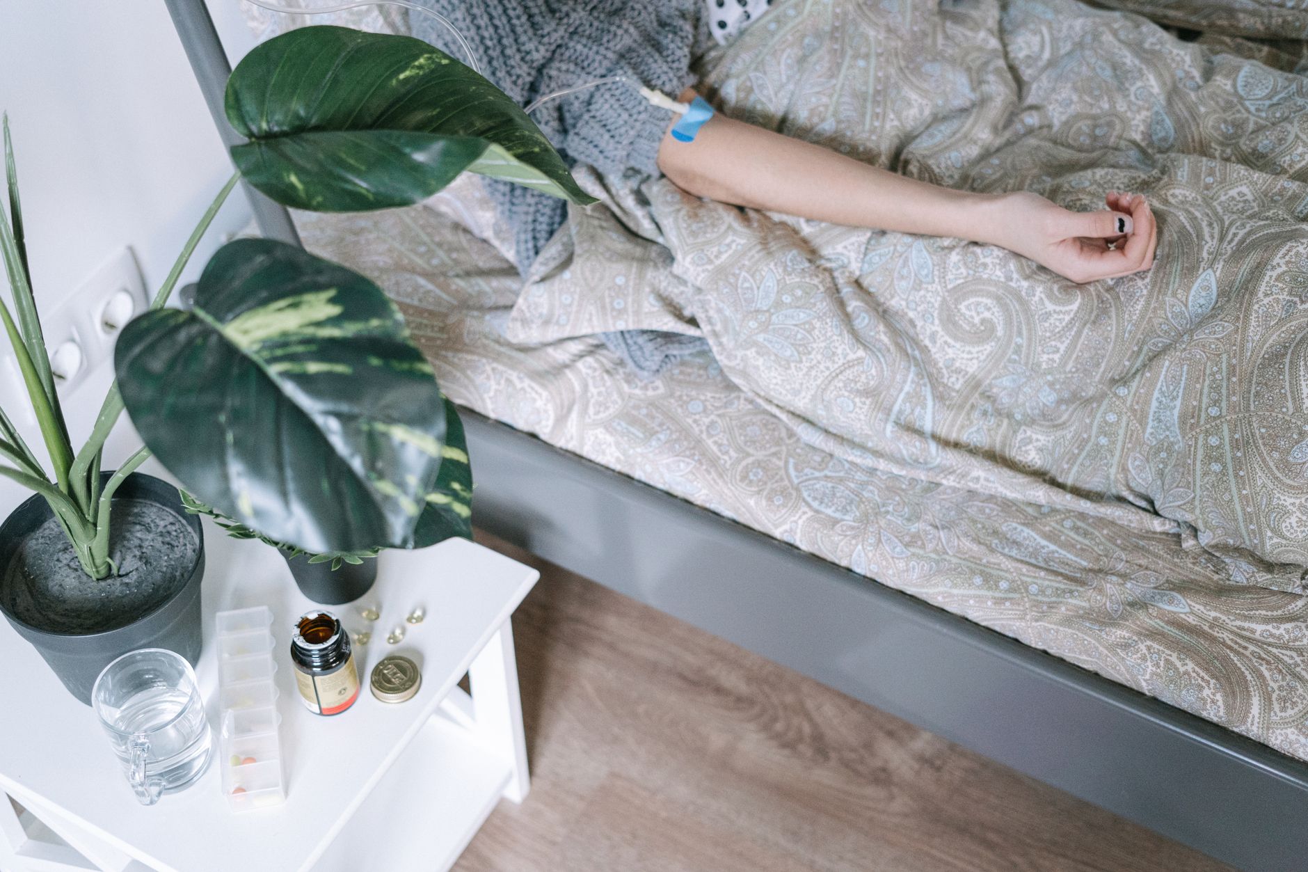 Cardiac patient resting comfortably at home during recovery with prescribed medications nearby