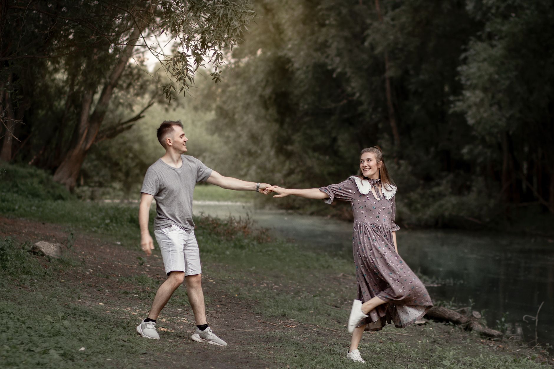 A couple enjoying a steady-paced walk together outdoors as part of a cardiac recovery routine