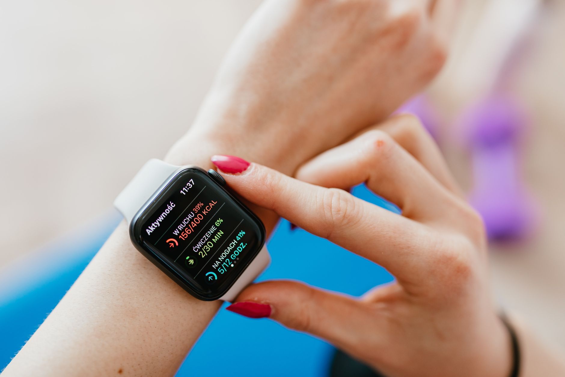 A young person checking their heart rate on a smartwatch during exercise