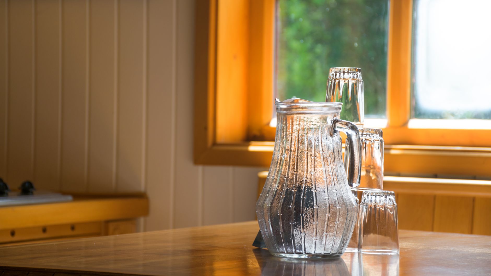 A clear glass of water on a table — plain water is generally allowed during a cardiac fasting test