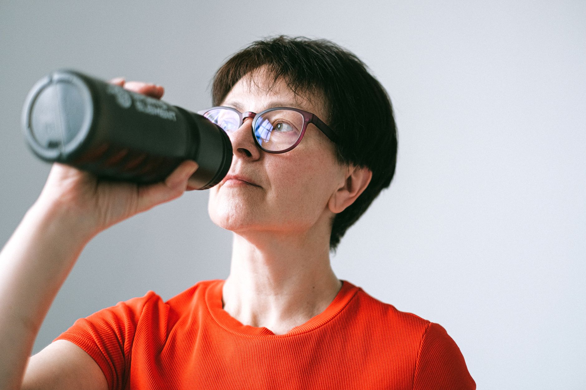 Senior person staying hydrated during a religious fast
