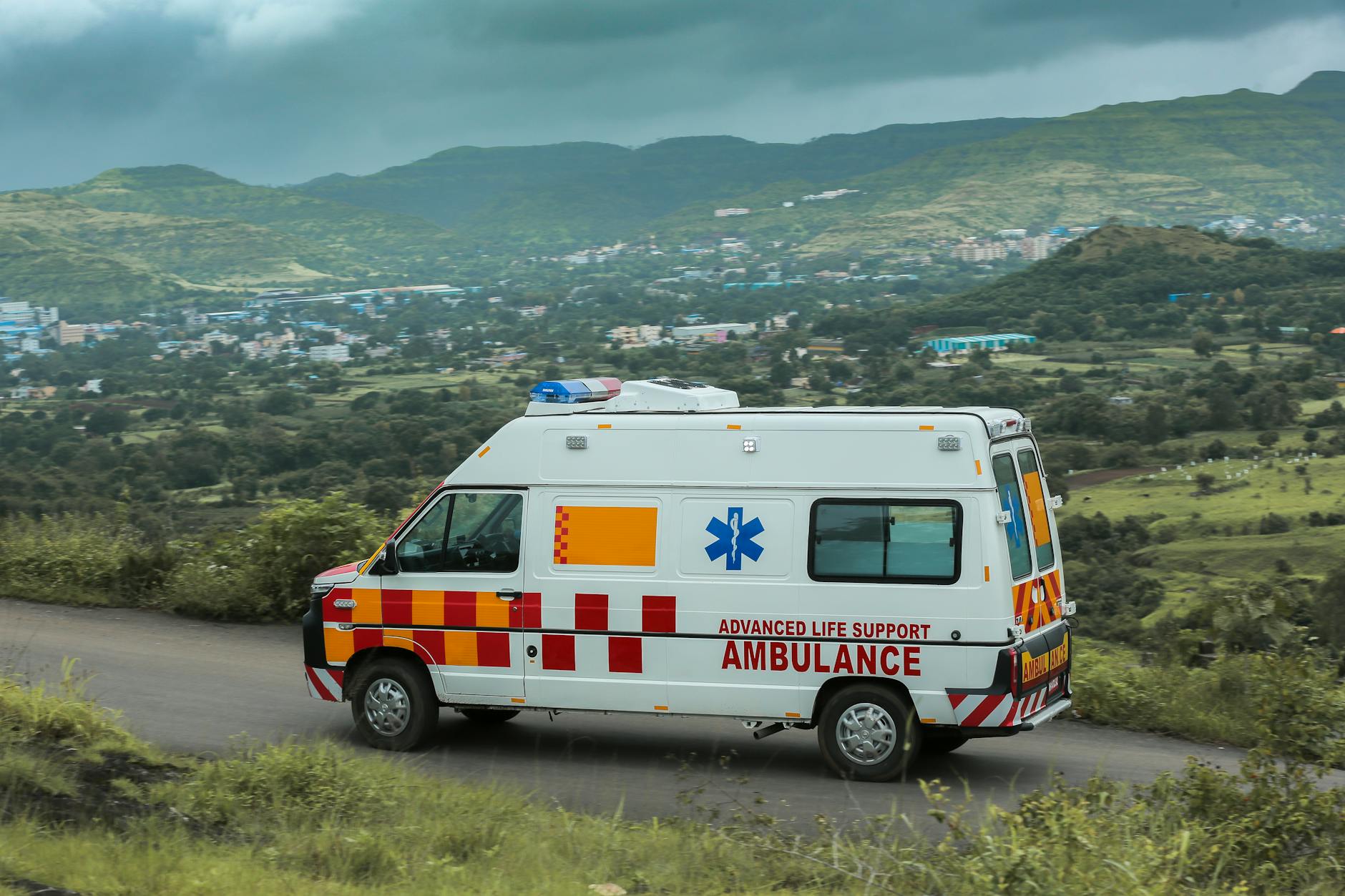 An ambulance rushing on a road, representing the importance of calling emergency services quickly during a cardiac event