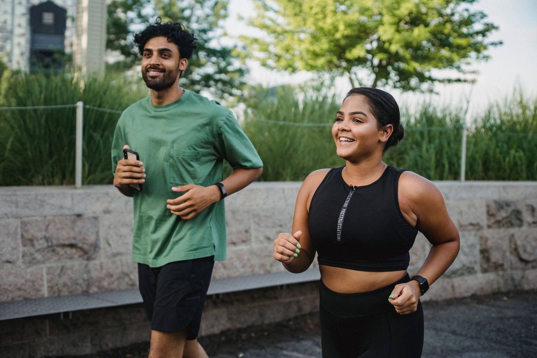 Young couple jogging in a park as part of a heart-healthy lifestyle