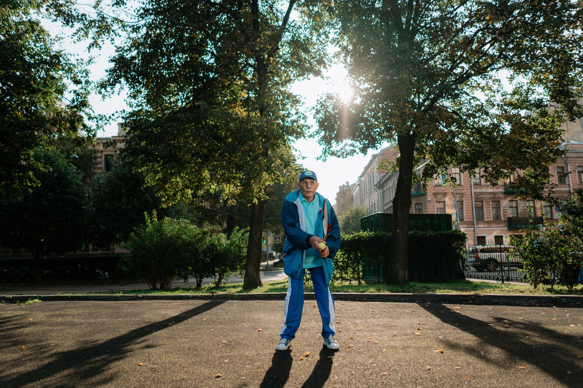 A senior man enjoying a morning walk in a park for heart health