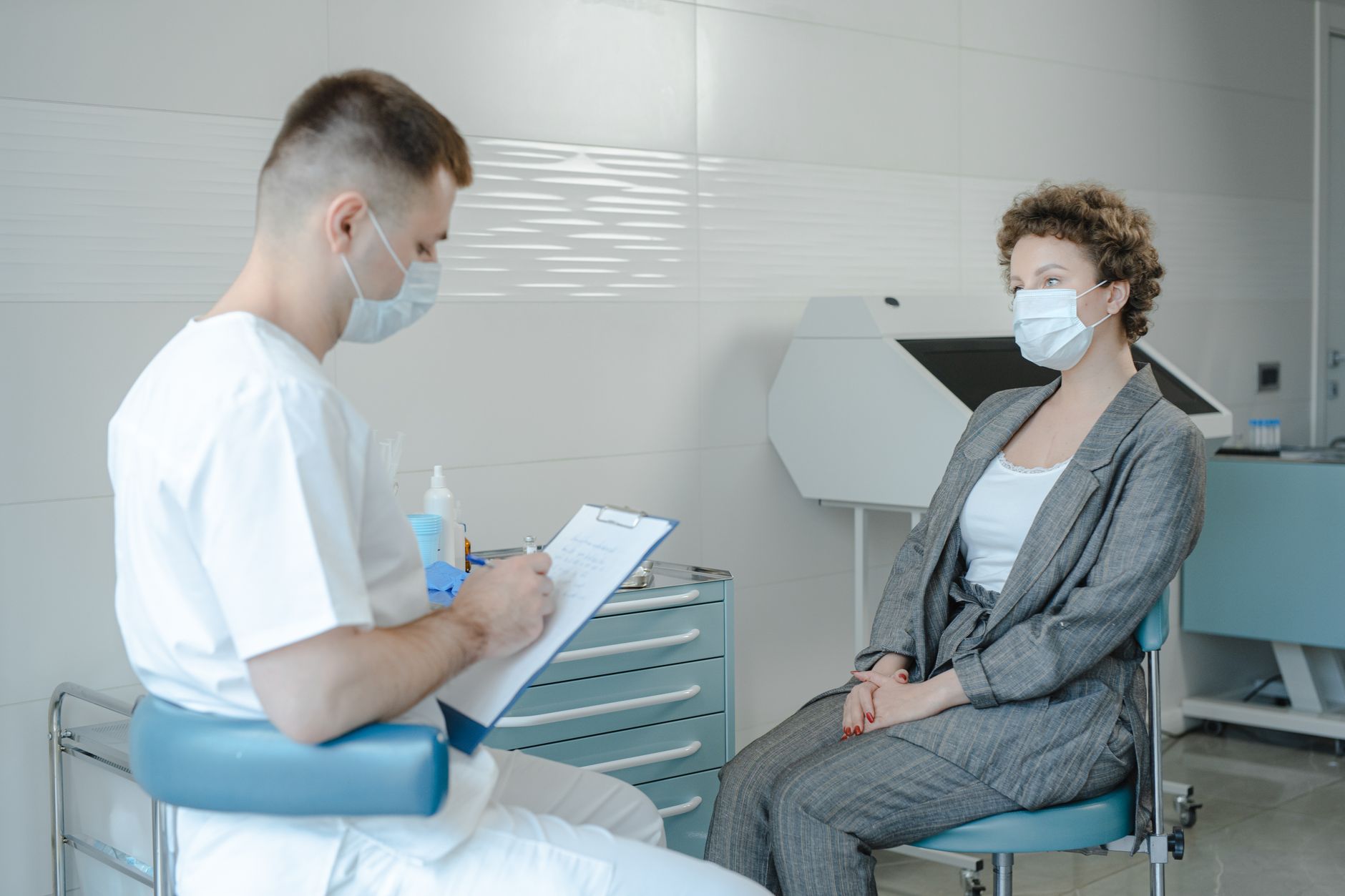 A woman having a health consultation with her doctor at a clinic