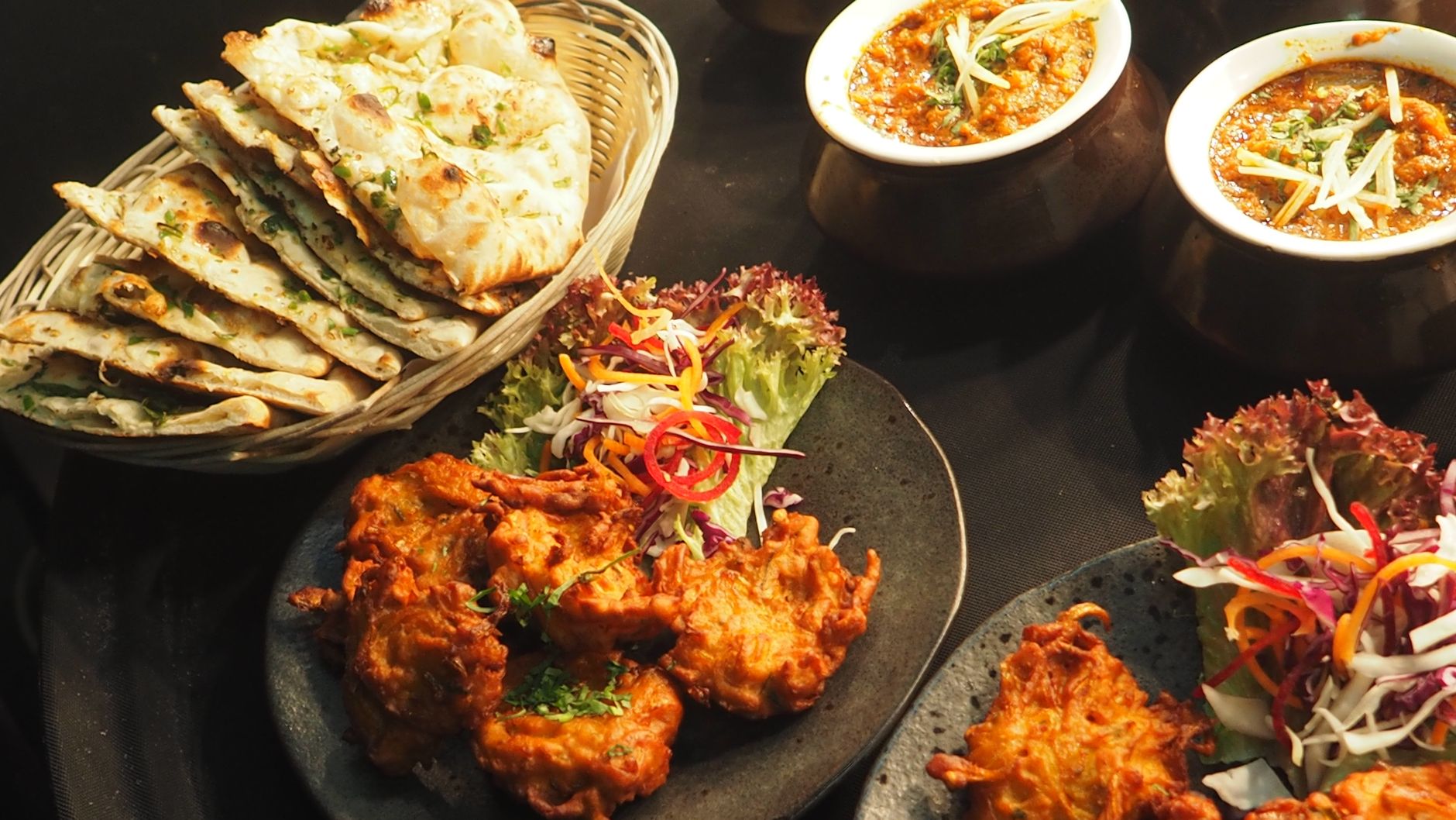 A plate of healthy Indian food including lentils and fresh vegetables, representing a heart-friendly diet