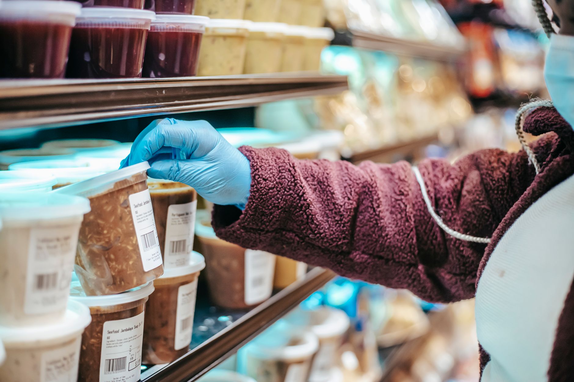 Woman carefully reading the nutrition label on a packaged food product