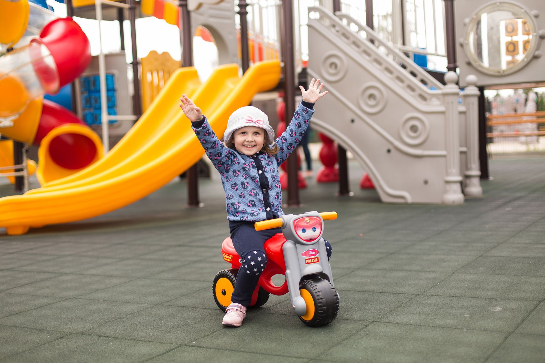 A happy child playing outdoors in a park on a sunny day