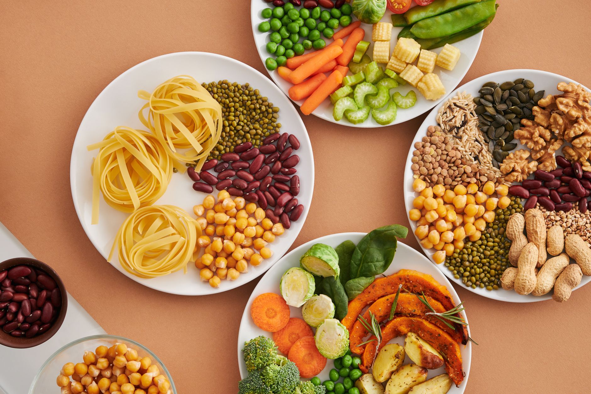A plate of green leafy vegetables, lentils and legumes rich in folate and B vitamins for heart health