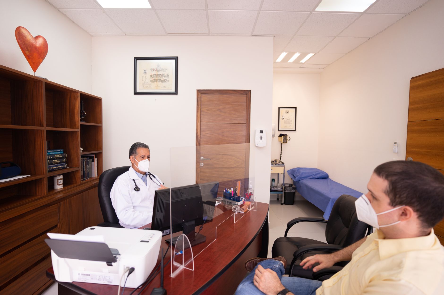 A senior patient having a detailed consultation with a cardiologist