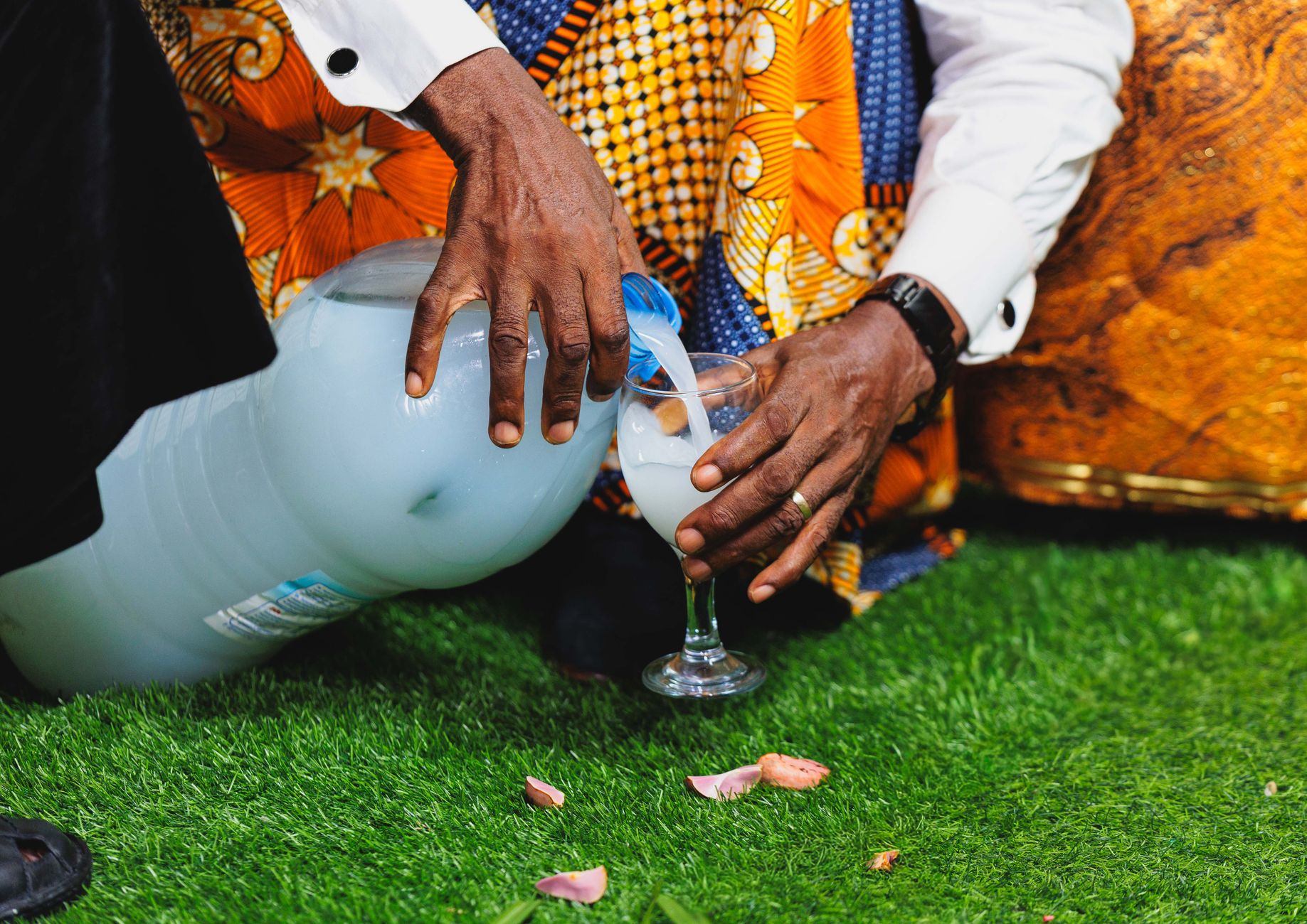 A family staying hydrated by drinking water while enjoying an outdoor festival