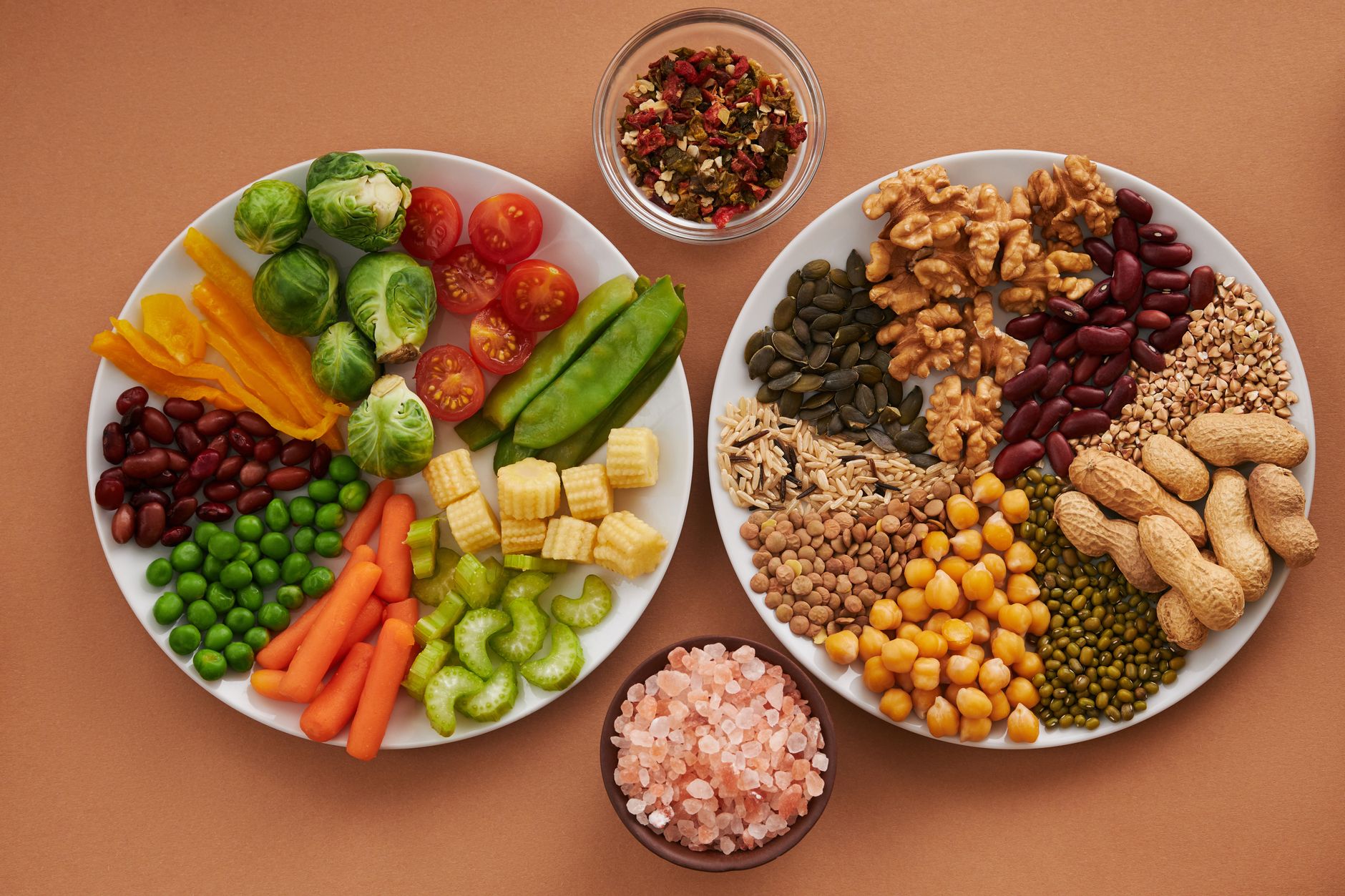 A spread of heart-healthy foods including vegetables, nuts, and seeds
