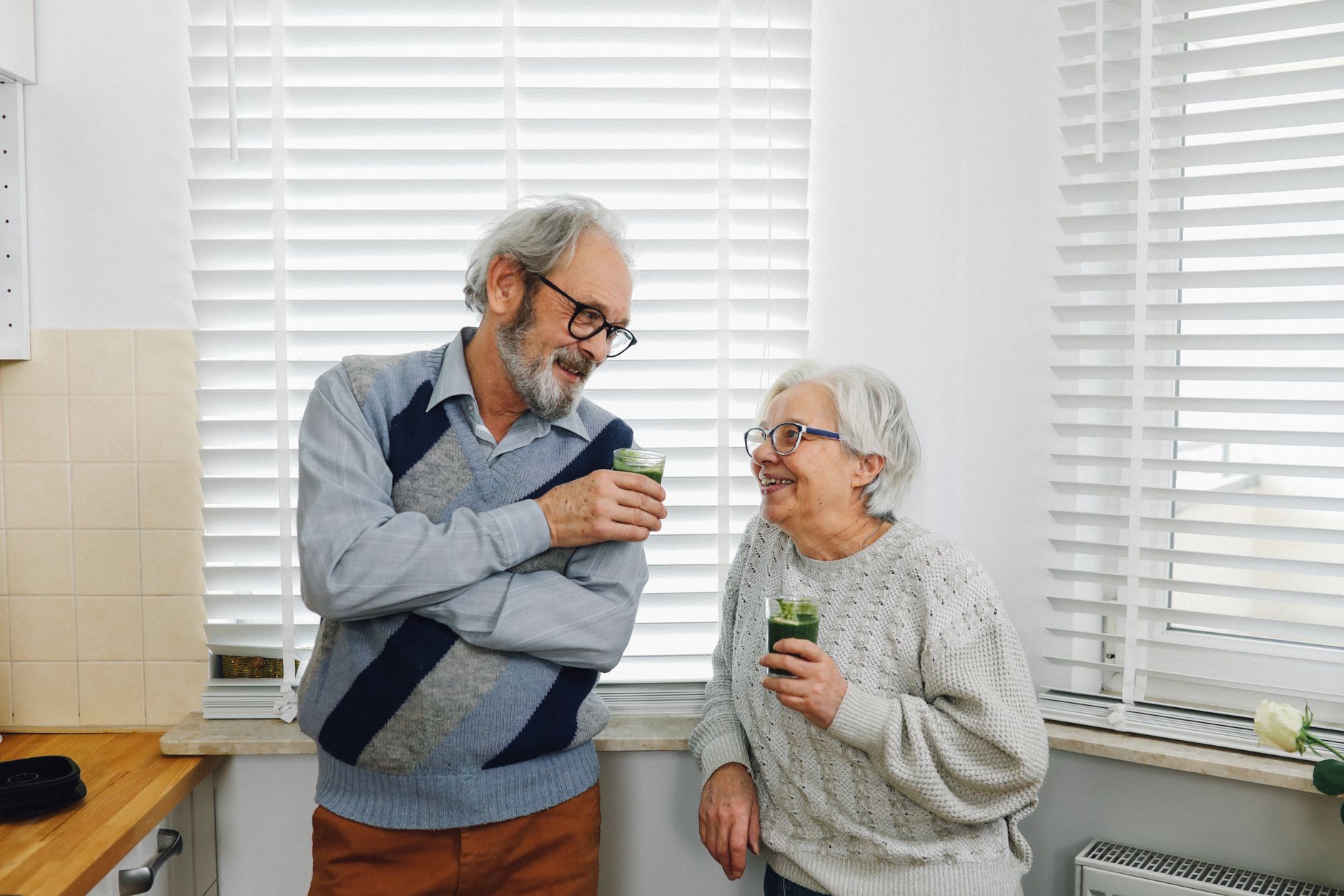 A senior couple enjoying a colourful, healthy home-cooked meal together