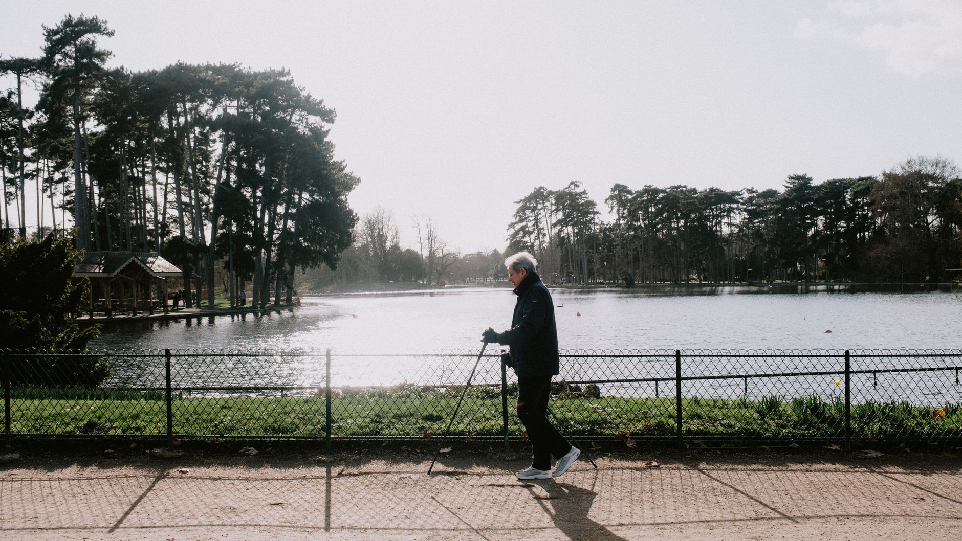A woman enjoying morning sunlight outdoors, a natural source of vitamin D