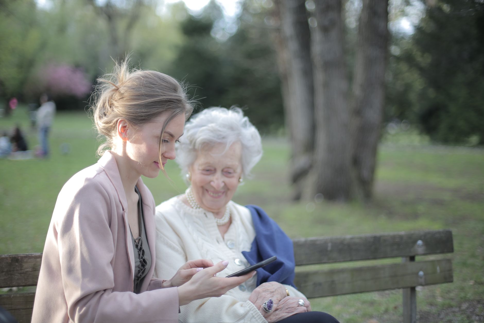 Elderly heart patient enjoying a walk with family support
