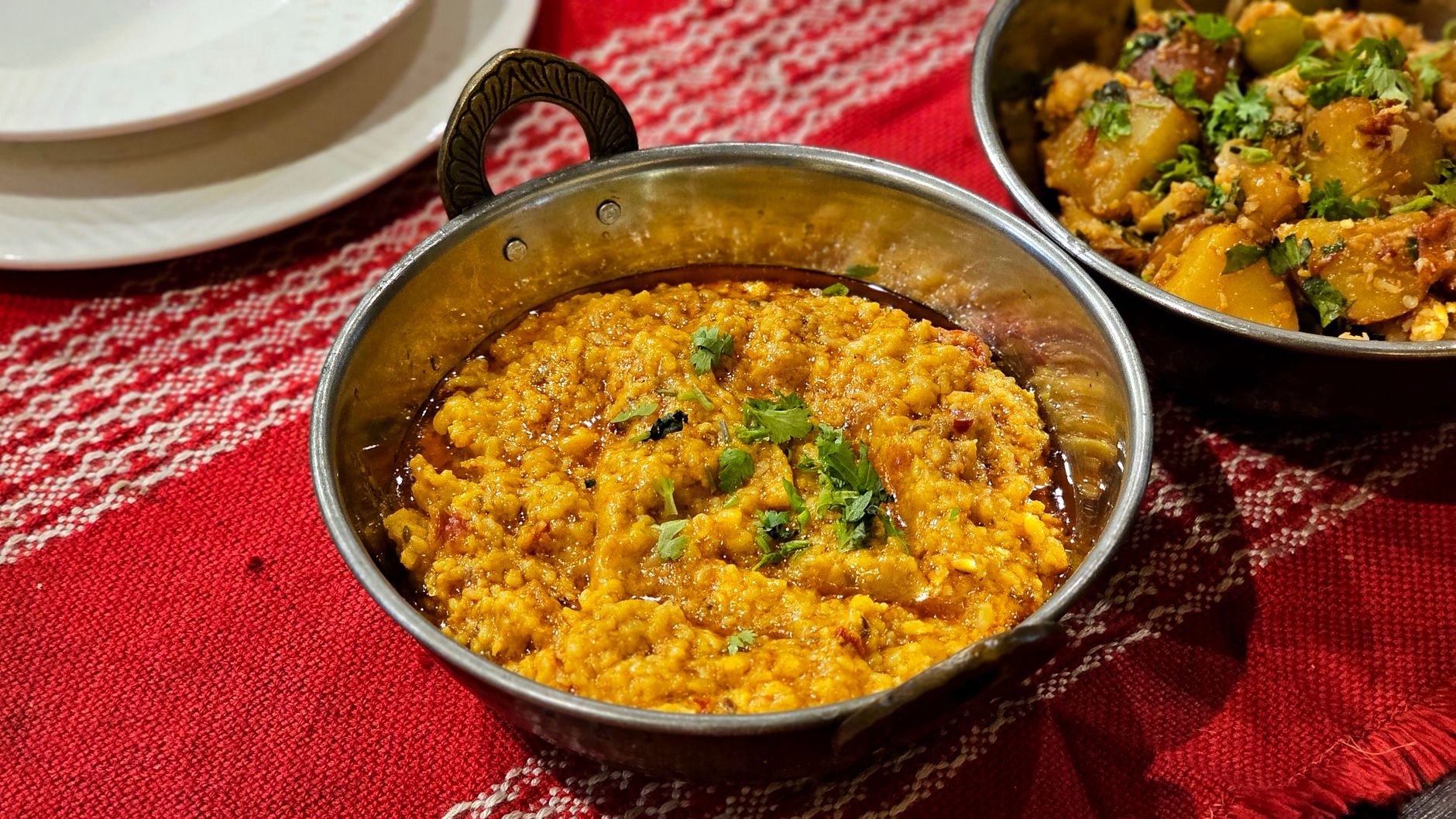 Woman preparing dal at home — a daily heart-healthy ritual in Gujarati households