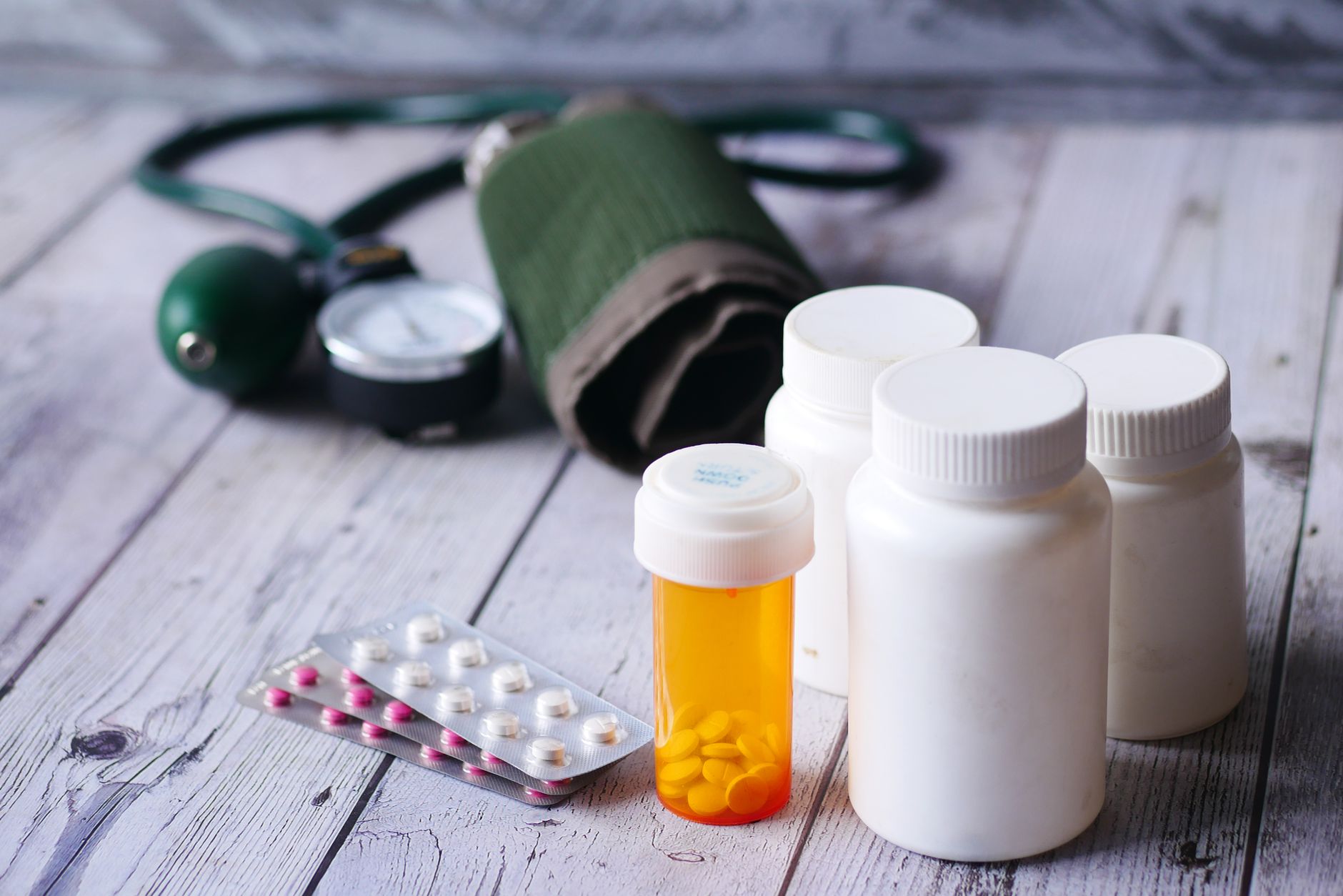 Several blood pressure medication tablets arranged on a surface