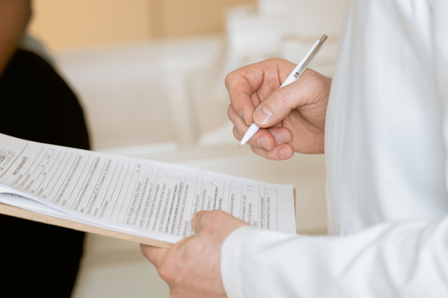 A doctor reviewing a blood test report with a patient during a cardiology consultation