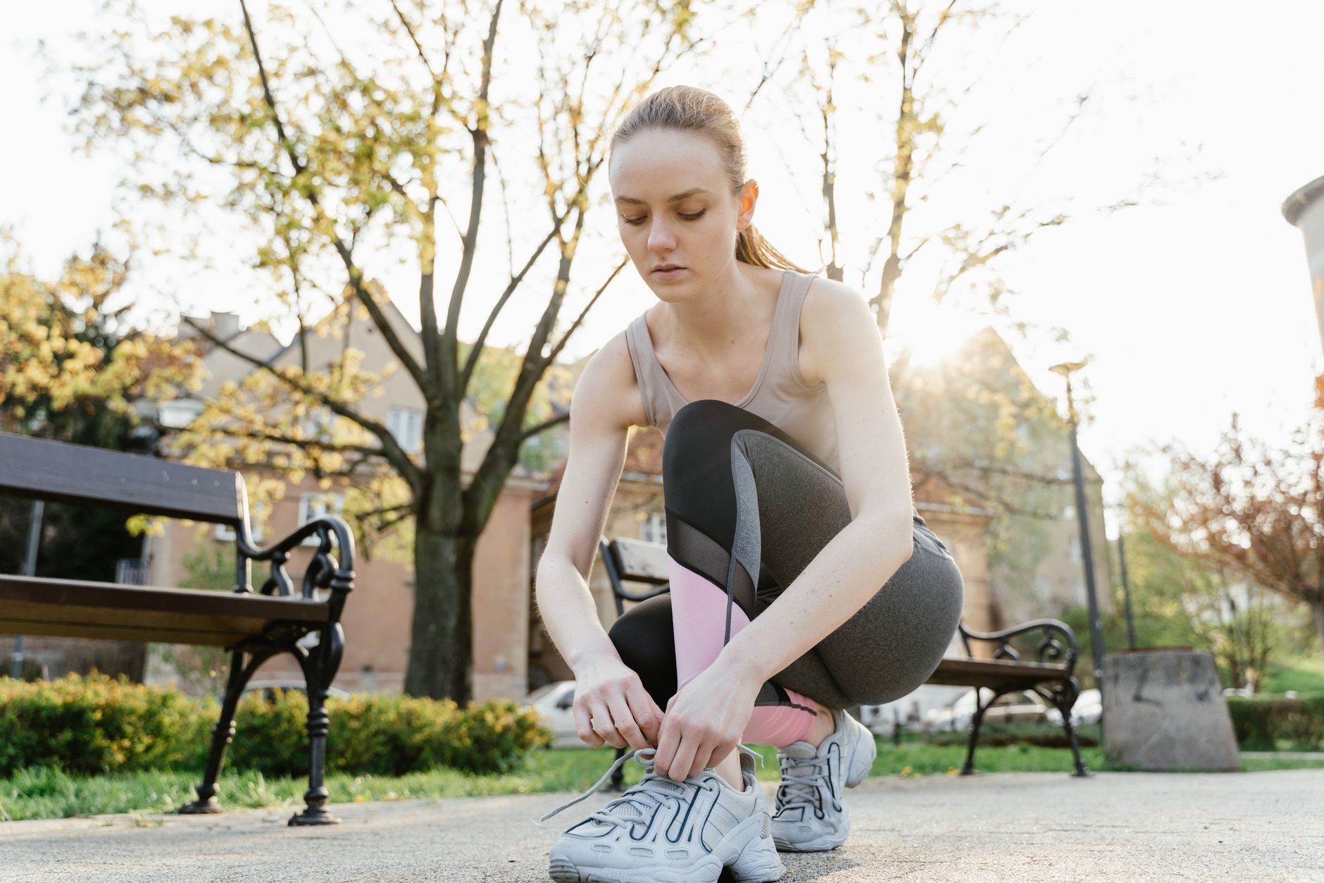 A young person jogging in a park, representing the importance of heart health in youth