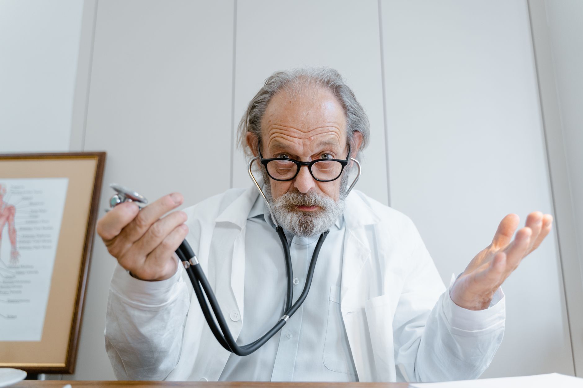 Elderly patient having a cardiac consultation with a cardiologist to discuss aortic valve disease