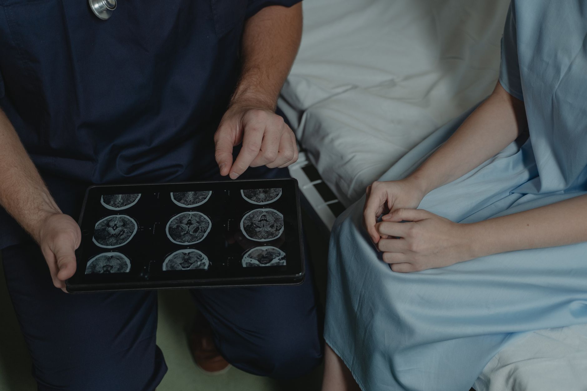 Doctor explaining a brain scan result to a patient