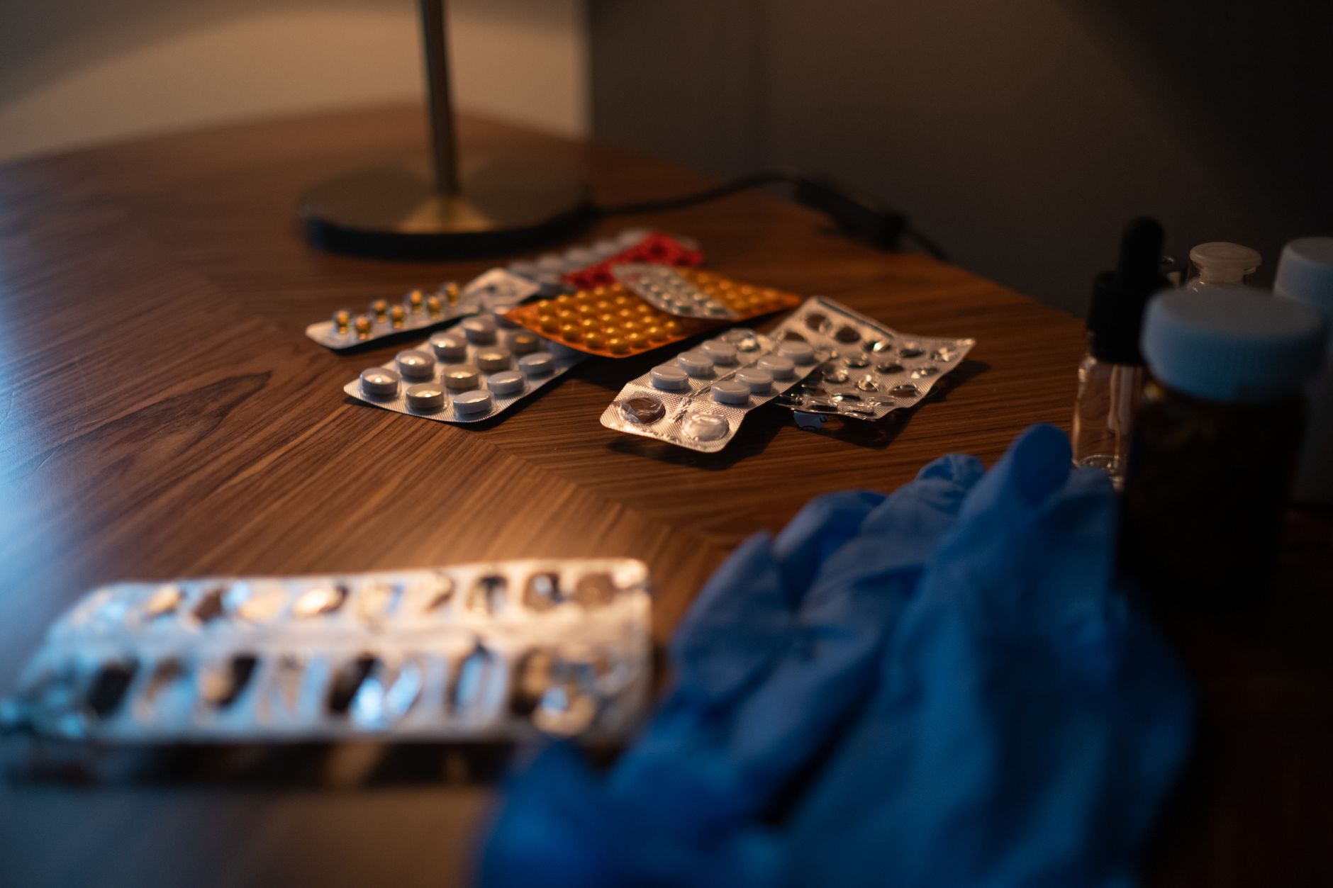 A neatly organized set of prescription medication bottles on a table