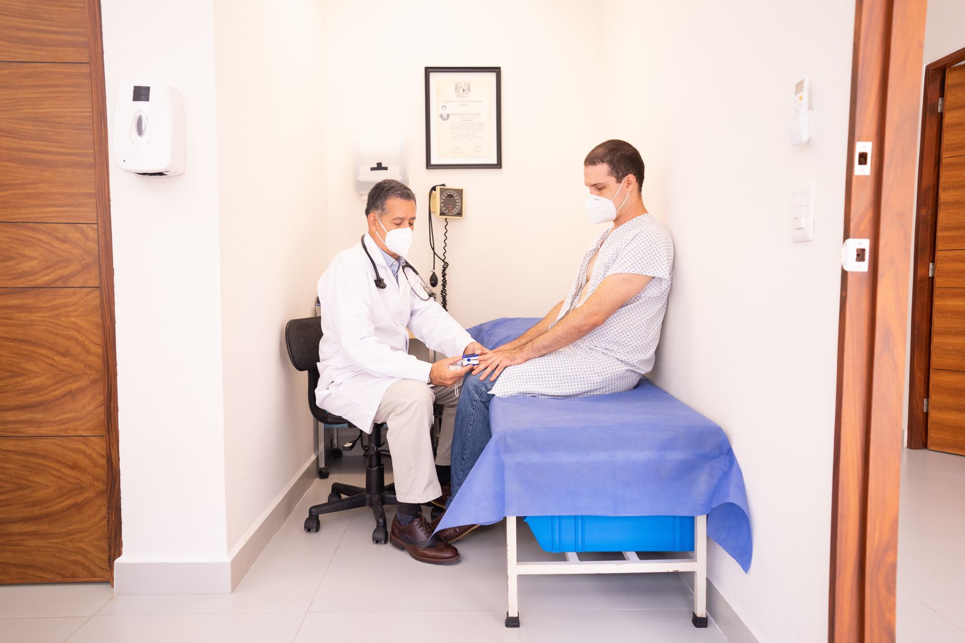 A patient discussing follow-up care with a cardiologist at a clinic