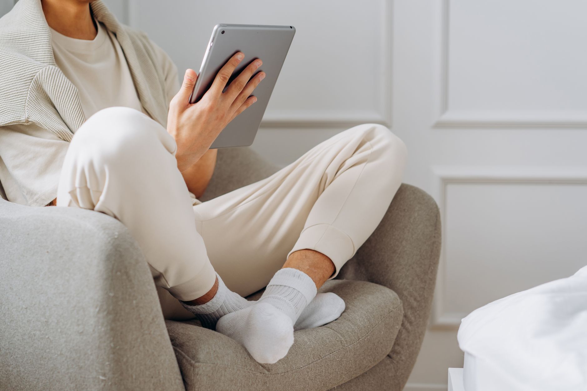 A person resting with legs elevated to relieve leg heaviness and swelling