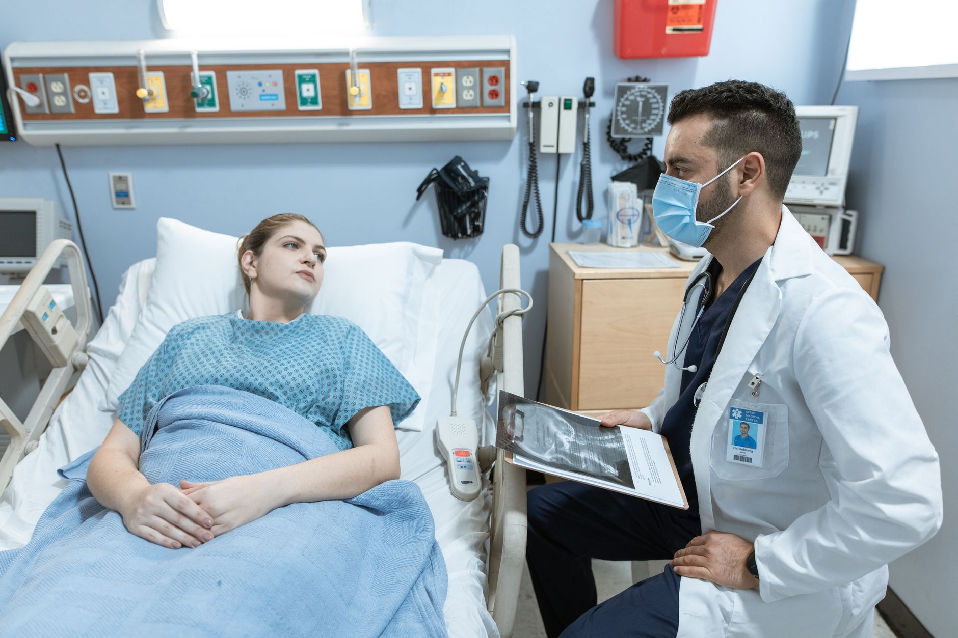 Doctor explaining a health risk chart to a patient during a consultation