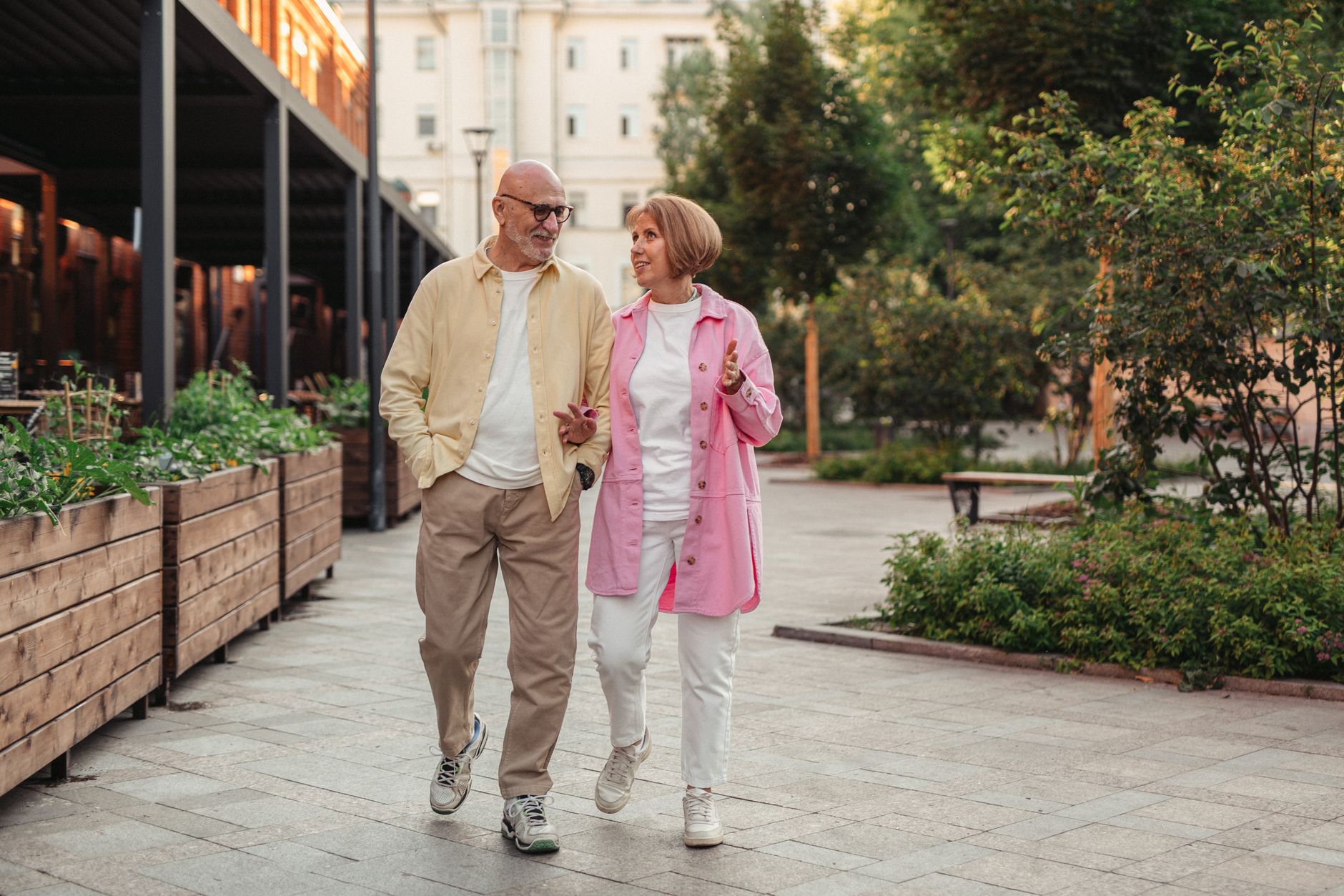 Senior couple enjoying a brisk walk together outdoors