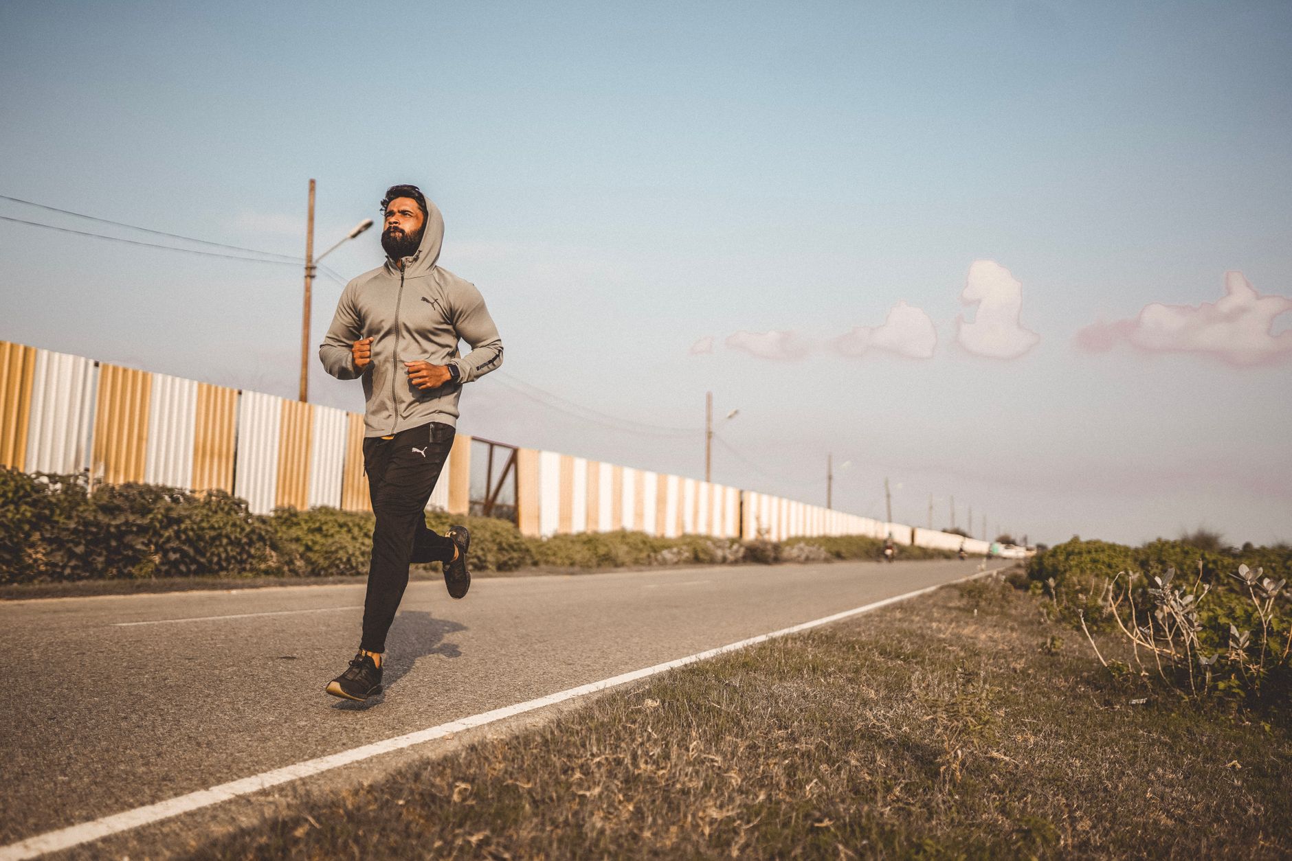 Person jogging on a running track in the morning
